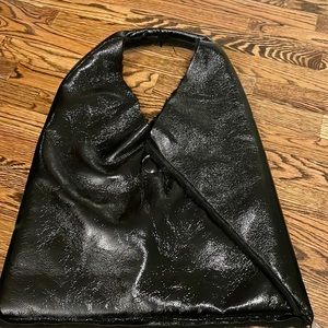 Reversible patent leather and faux fur tote